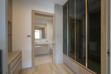 Modern bedroom with ensuite bathroom and wooden furnishings