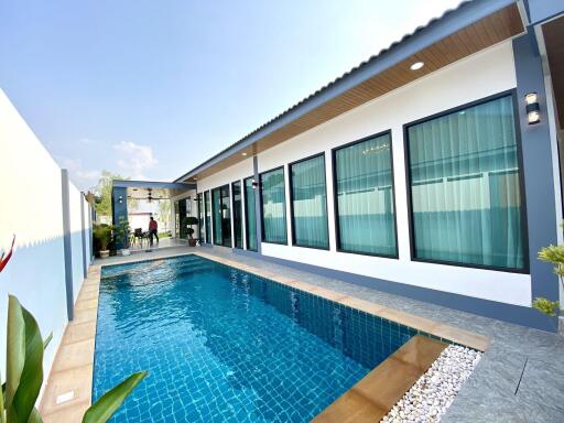 Outdoor pool area with adjacent modern building