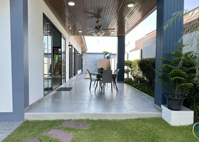 Outdoor patio with seating area and covered roof