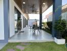 Outdoor patio with seating area and covered roof