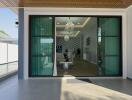 Stylish entrance leading into a modern living room with glass doors