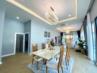 Modern dining area with chandelier