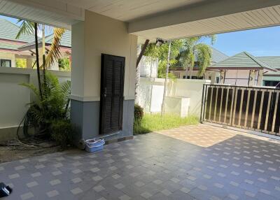 Covered garage with tiled flooring