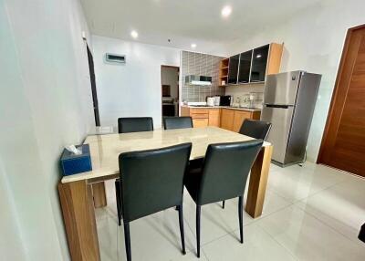 Modern kitchen and dining area with table and chairs