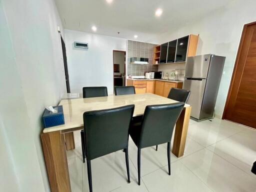 Modern kitchen and dining area with table and chairs