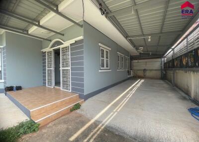 Covered entryway with attached garage