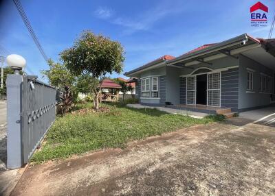 Front view of a house with garden and driveway