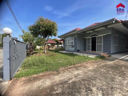 Front view of a house with garden and driveway