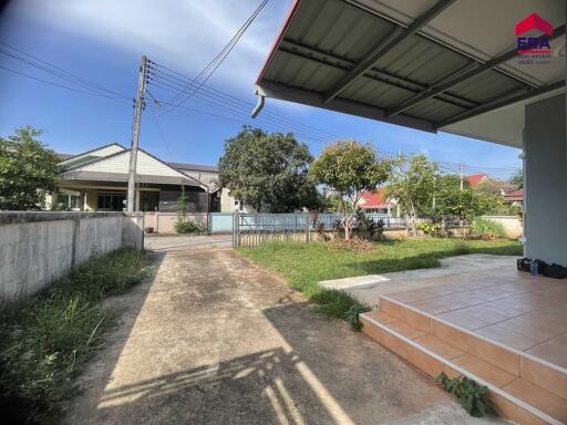 House exterior with a driveway and a front yard