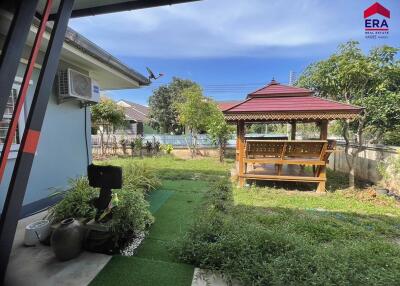 Well-maintained garden with gazebo and lawn