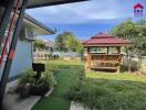 Well-maintained garden with gazebo and lawn