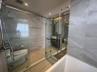 Modern bathroom with glass shower and bathtub