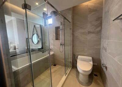 Modern bathroom with glass shower and bathtub