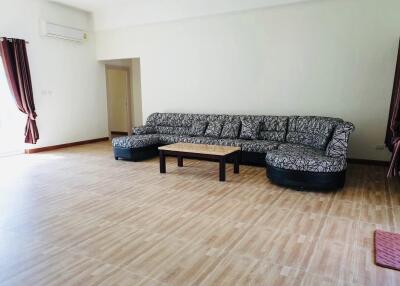 Spacious living room with sectional sofa and coffee table