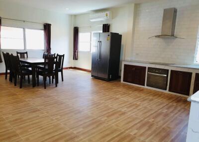 Spacious kitchen and dining area with modern appliances