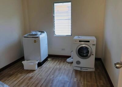 Laundry room with washing machine and dryer