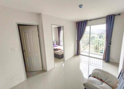 Bright bedroom with balcony and adjoining room