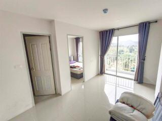Bright bedroom with balcony and adjoining room