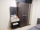 Bedroom with a closet and dressing table