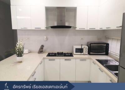 Modern white kitchen with appliances