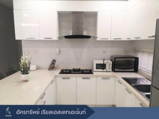 Modern white kitchen with appliances