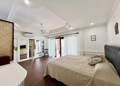 Spacious and well-lit bedroom with modern amenities