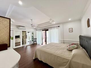 Spacious and well-lit bedroom with modern amenities