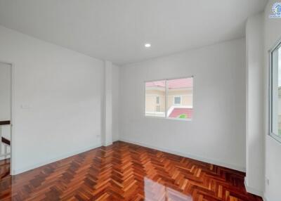 Bright empty bedroom with wooden parquet flooring