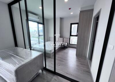 Modern bedroom with large windows and glass dividers