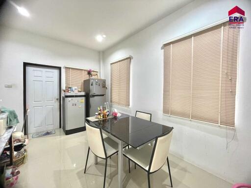 Modern kitchen with dining table and appliances