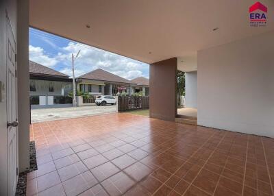 Covered patio area with tiled flooring and view of neighborhood