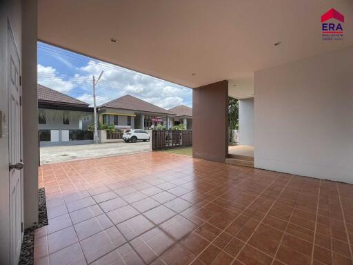 Covered patio area with tiled flooring and view of neighborhood