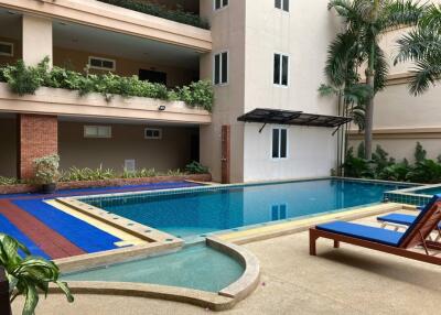 Outdoor swimming pool area in an apartment complex