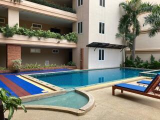 Outdoor swimming pool area in an apartment complex