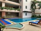 Outdoor swimming pool area in an apartment complex