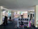 Spacious apartment gym with various fitness equipment