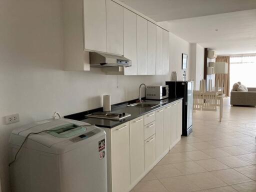 Modern kitchen with appliances and dining area