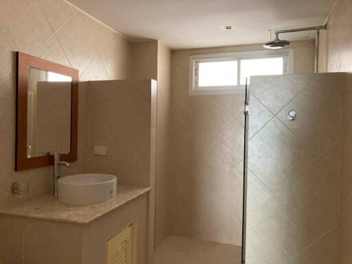 Spacious bathroom with modern fixtures and shower