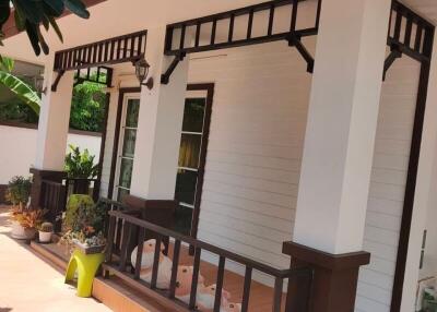 Front porch of a house with decorative plants