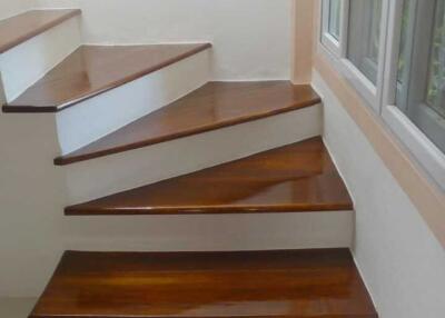 Modern wooden staircase with window