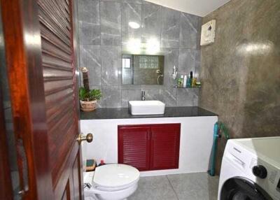 Modern bathroom with laundry setup