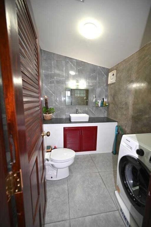 Modern bathroom with laundry setup