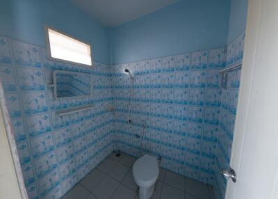 Simple bathroom with tiled walls