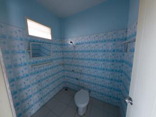 Simple bathroom with tiled walls