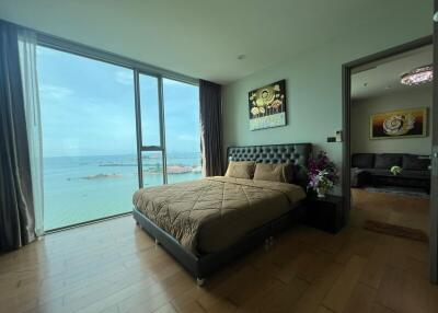 Bedroom with large windows and ocean view