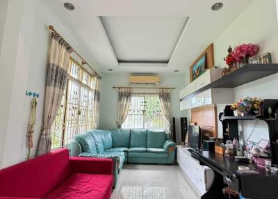 Spacious and well-lit living room with a combination of modern and traditional decor