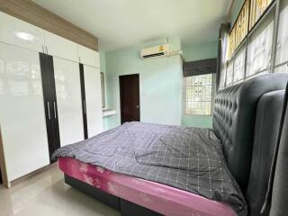 Bedroom with large closet and air conditioning