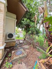 Outdoor side yard with air conditioning unit