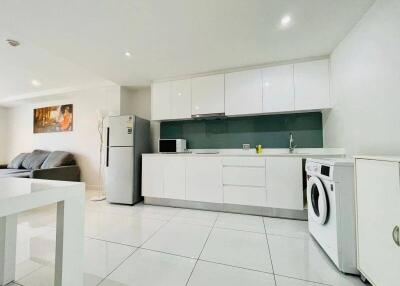 Modern kitchen with white cabinets and appliances