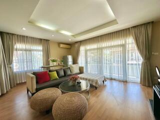 Well-lit living room with modern decor